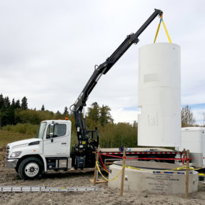 crane lifting cement tubes